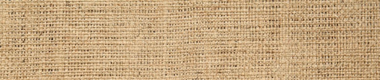 Image of Texture of natural burlap fabric as background, top view. Banner design