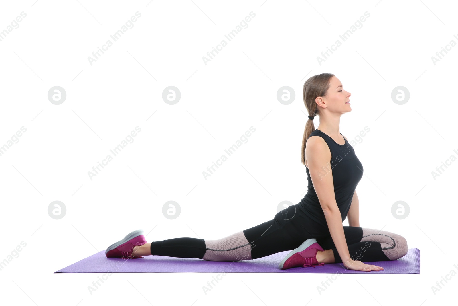 Photo of Young woman doing sports exercises isolated on white. Home fitness