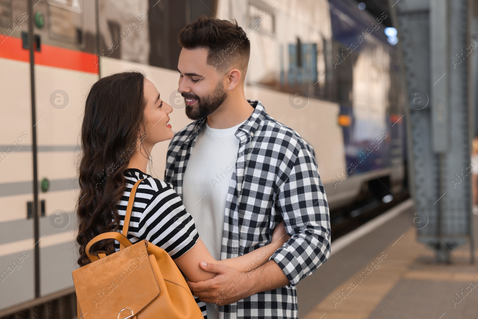 Photo of Long-distance relationship. Beautiful couple on platform of railway station