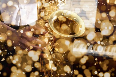 Christmas and New Year music. Man playing saxophone indoors, closeup. Bokeh effect