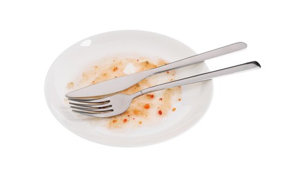 Dirty plate and cutlery on white background