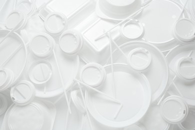 Different white plastic items as background, closeup