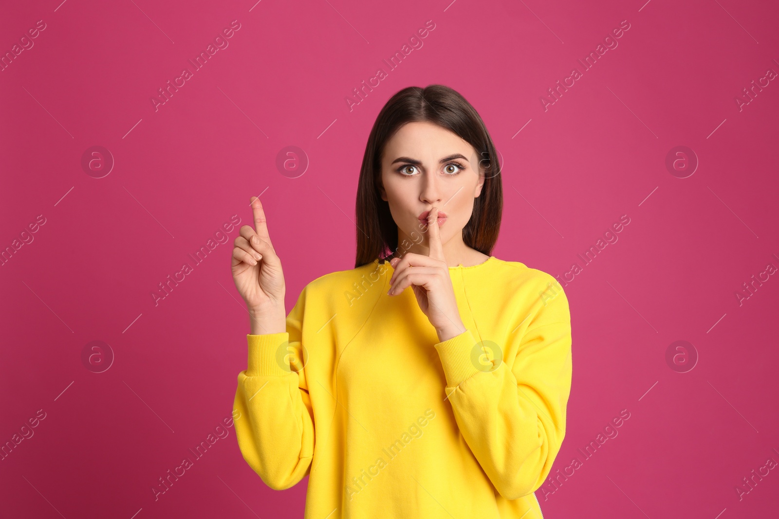 Photo of Portrait of young woman on pink background