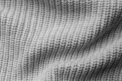 Photo of Grey knitted fabric as background, top view