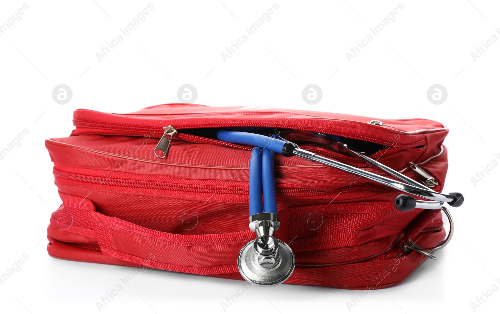 Photo of First aid kit with stethoscope on white background