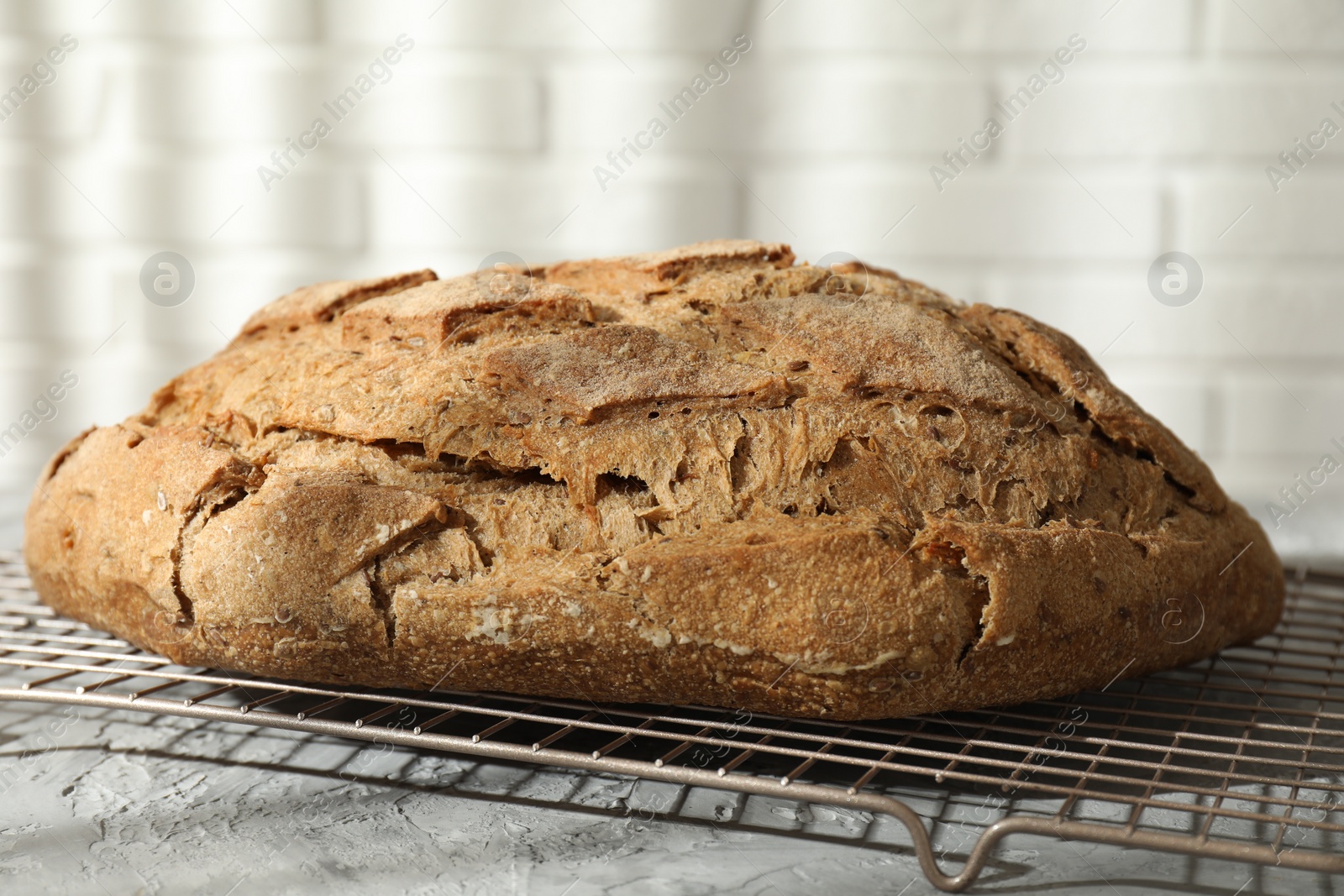 Photo of Freshly baked sourdough bread on grey table