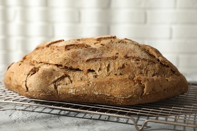 Photo of Freshly baked sourdough bread on grey table