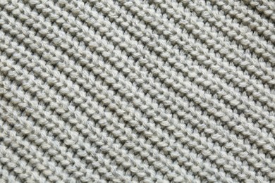 Photo of Beautiful grey knitted fabric as background, top view