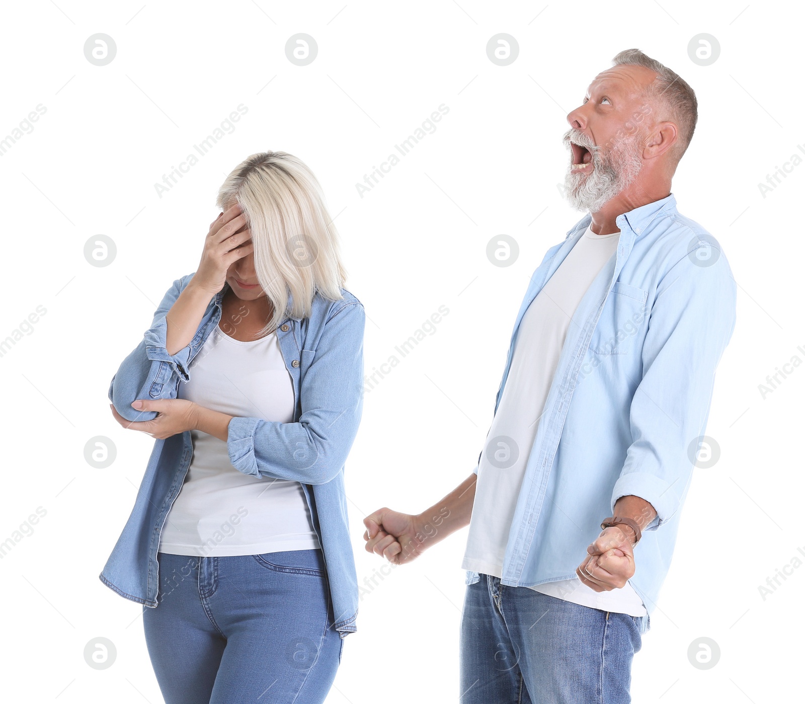 Photo of Mature couple having argument on white background. Relationship problems