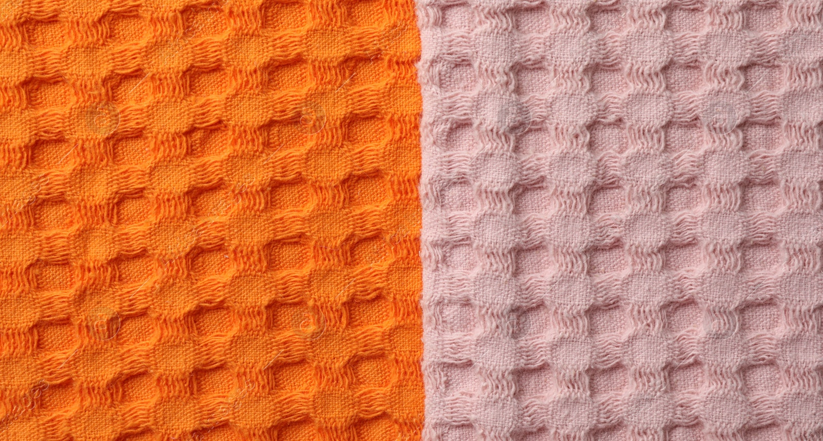 Photo of Orange and pink fabrics as background, top view