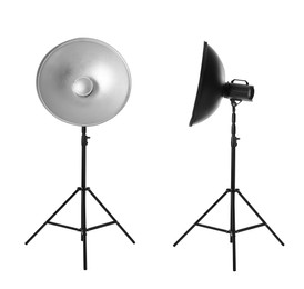 Image of Studio flash lights with reflectors on tripods against white background