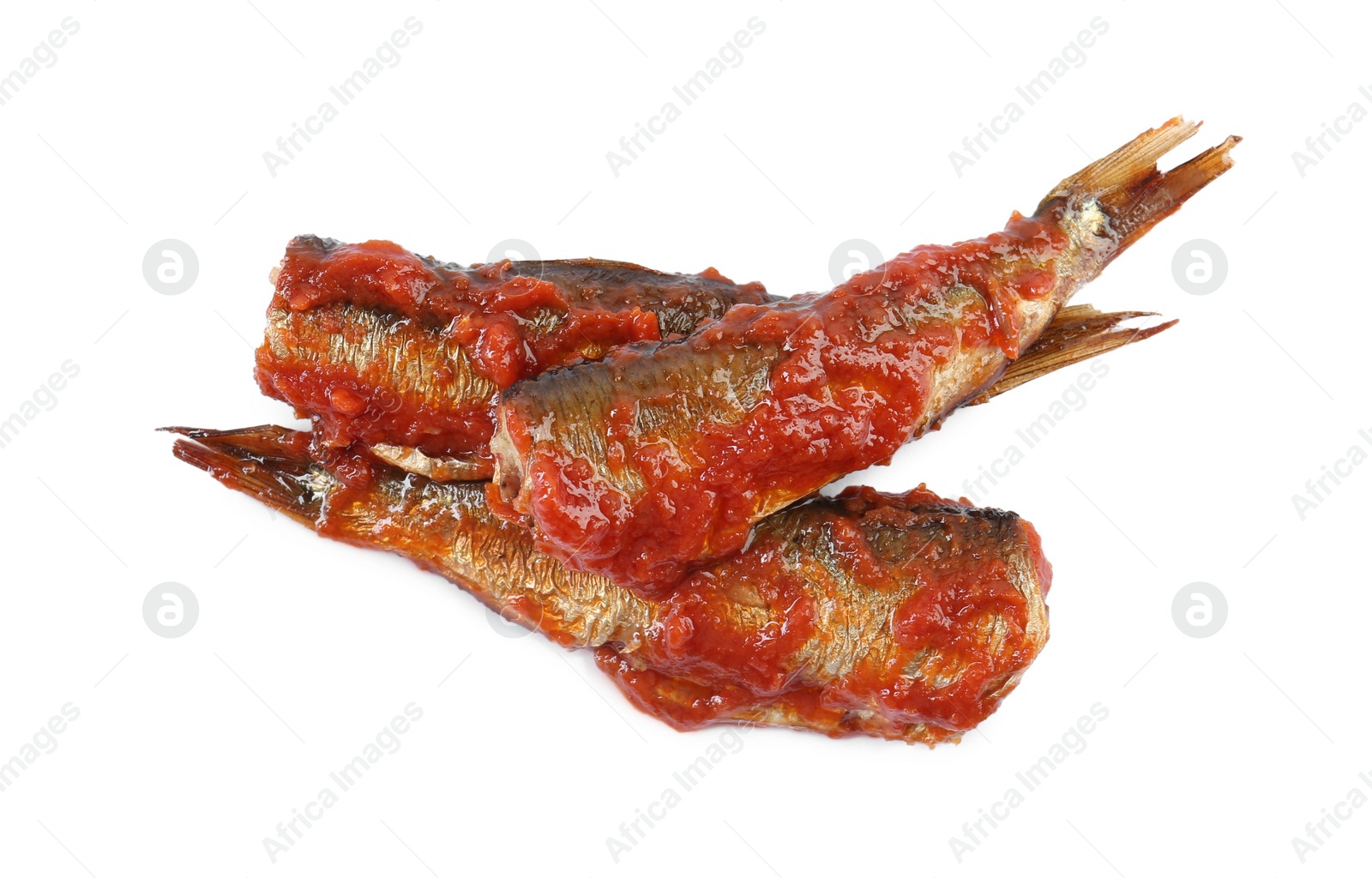 Photo of Tasty canned sprats with tomato sauce isolated on white, top view