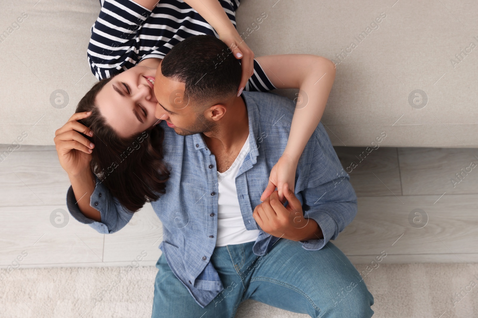 Photo of Dating agency. Couple spending time together at home, above view