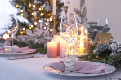 Beautiful festive table setting with Christmas decor indoors, space for text