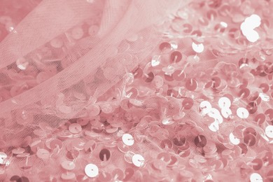 Photo of Beautiful pink fabric with shiny sequins as background, closeup