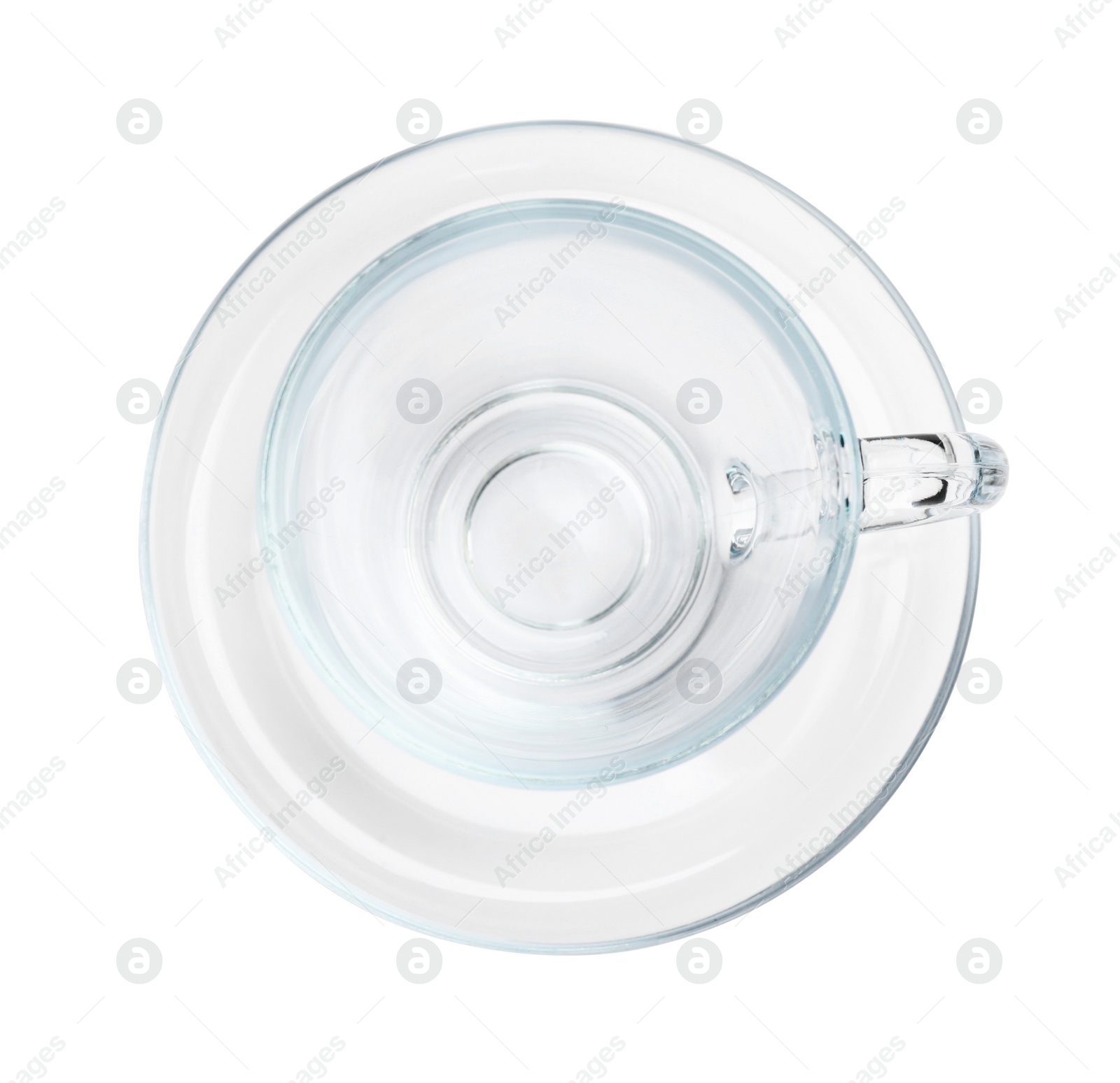 Photo of One clean glass cup and saucer isolated on white, top view