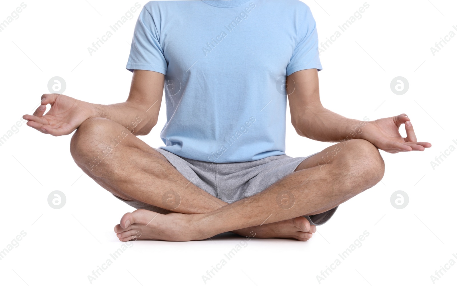 Photo of Man meditating on white background, closeup. Harmony and zen