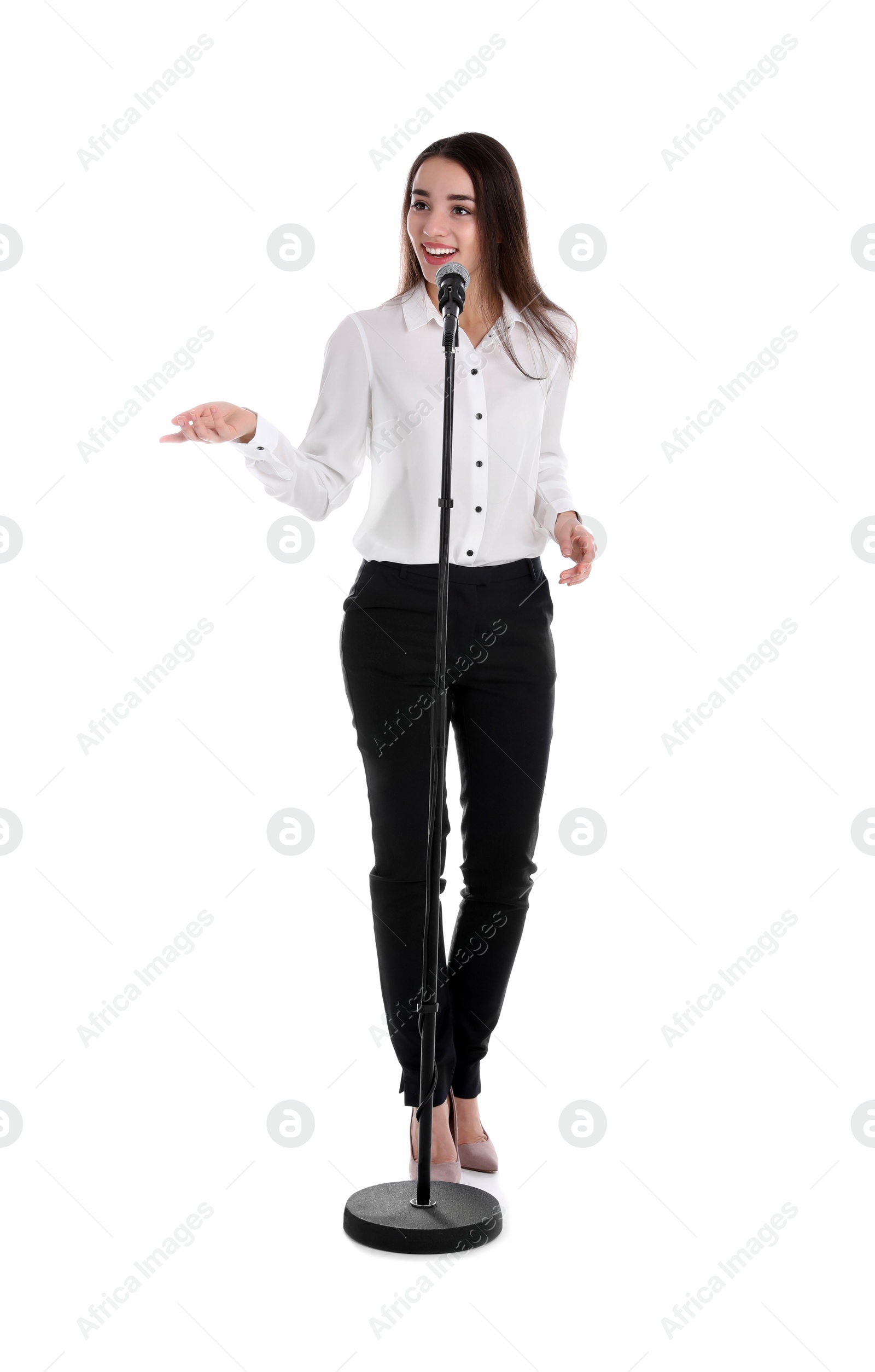 Photo of Young stylish woman with microphone on white background