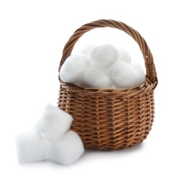 Photo of Wicker basket and cotton balls on white background