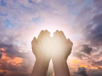 Image of Religion. Christian man praying against sky, closeup