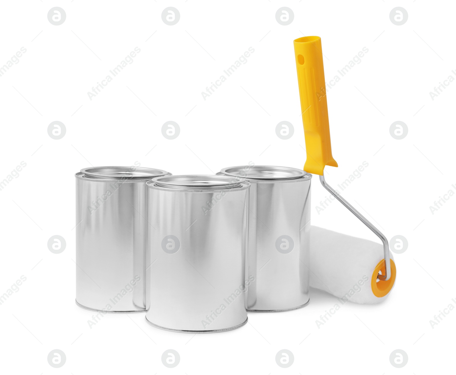 Photo of Cans of paints and roller on white background