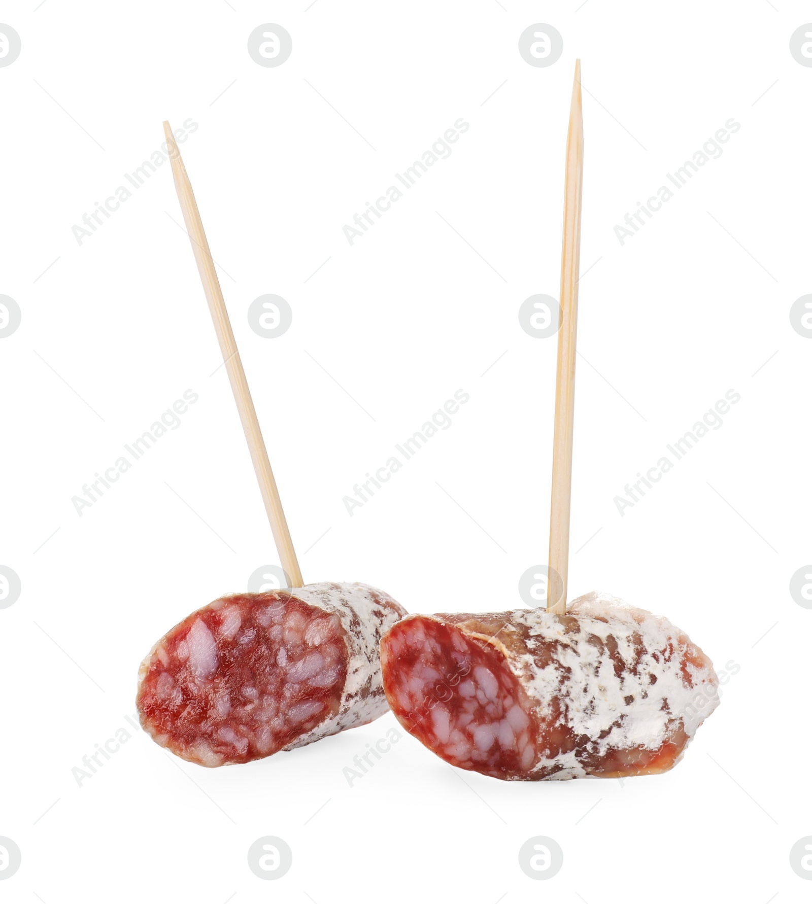 Photo of Toothpick appetizers. Tasty sausage pieces on white background