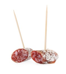 Photo of Toothpick appetizers. Tasty sausage pieces on white background