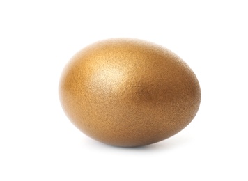 Photo of One shiny golden egg on white background