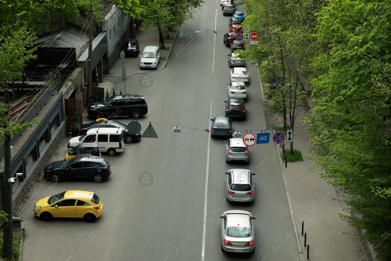 Photo of Cars in traffic jam on city street, aerial view