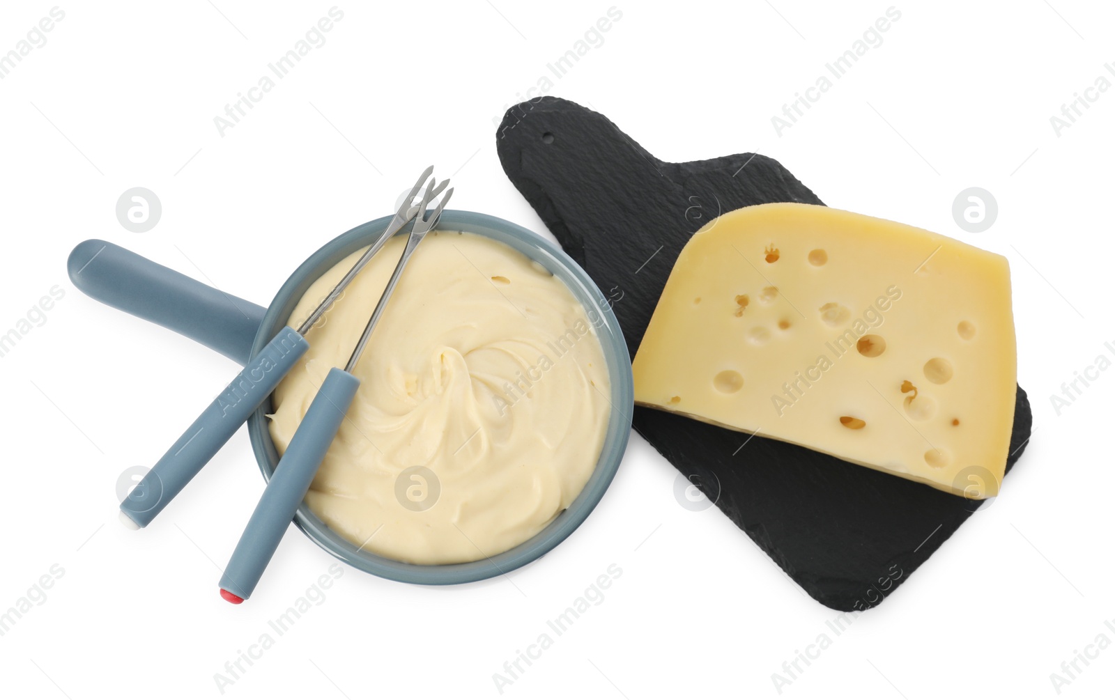 Photo of Fondue with tasty melted cheese, forks and piece isolated on white, top view