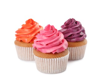 Different delicious colorful cupcakes on white background