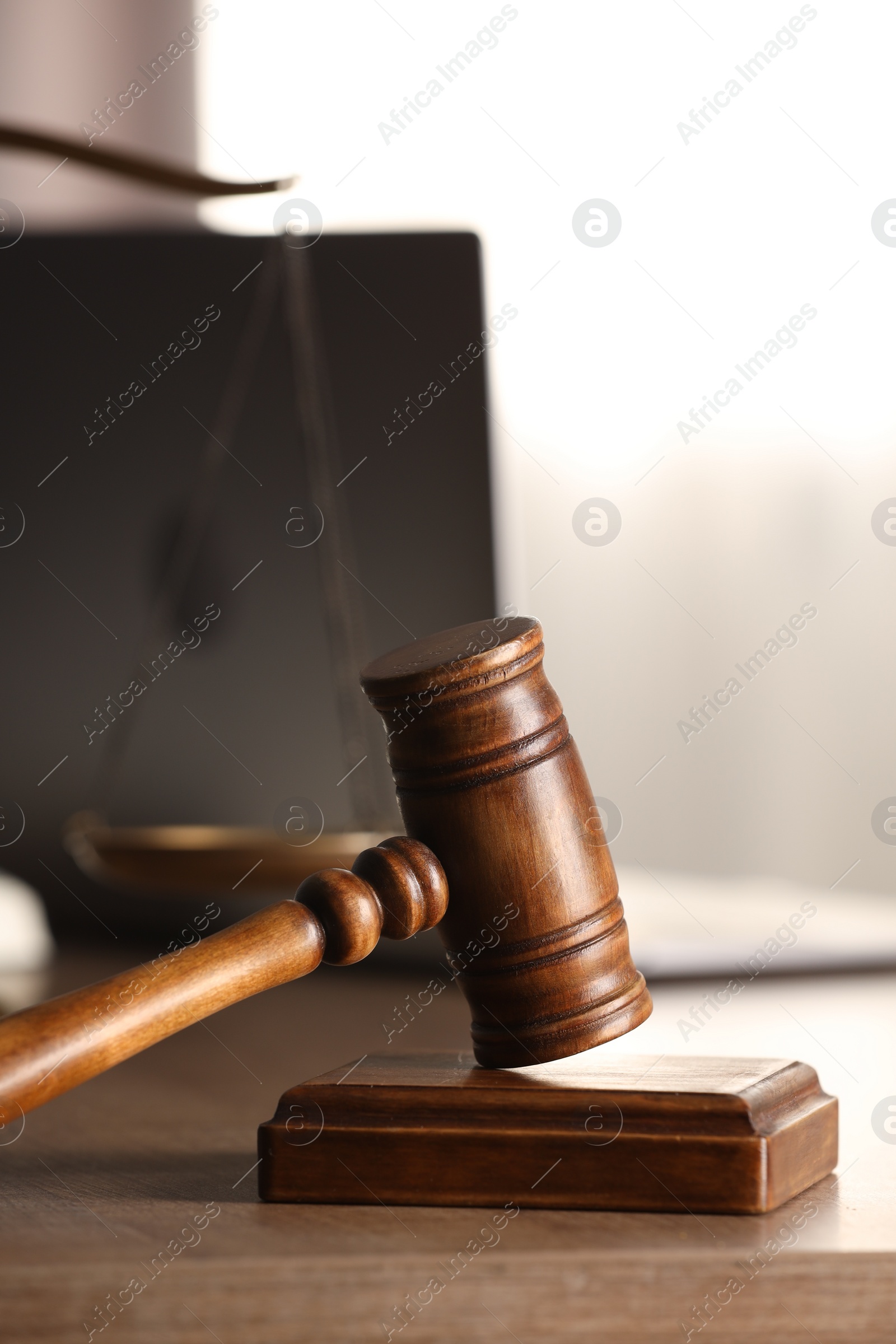 Photo of Law concept. Gavel and sound block on wooden table