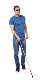 Photo of Blind man with long cane on white background