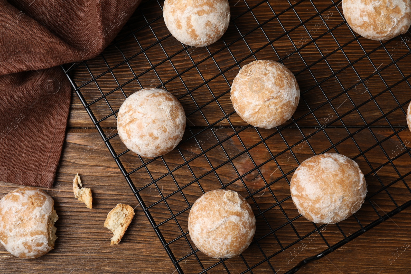 Photo of Tasty homemade gingerbread cookies on wooden table, flat lay