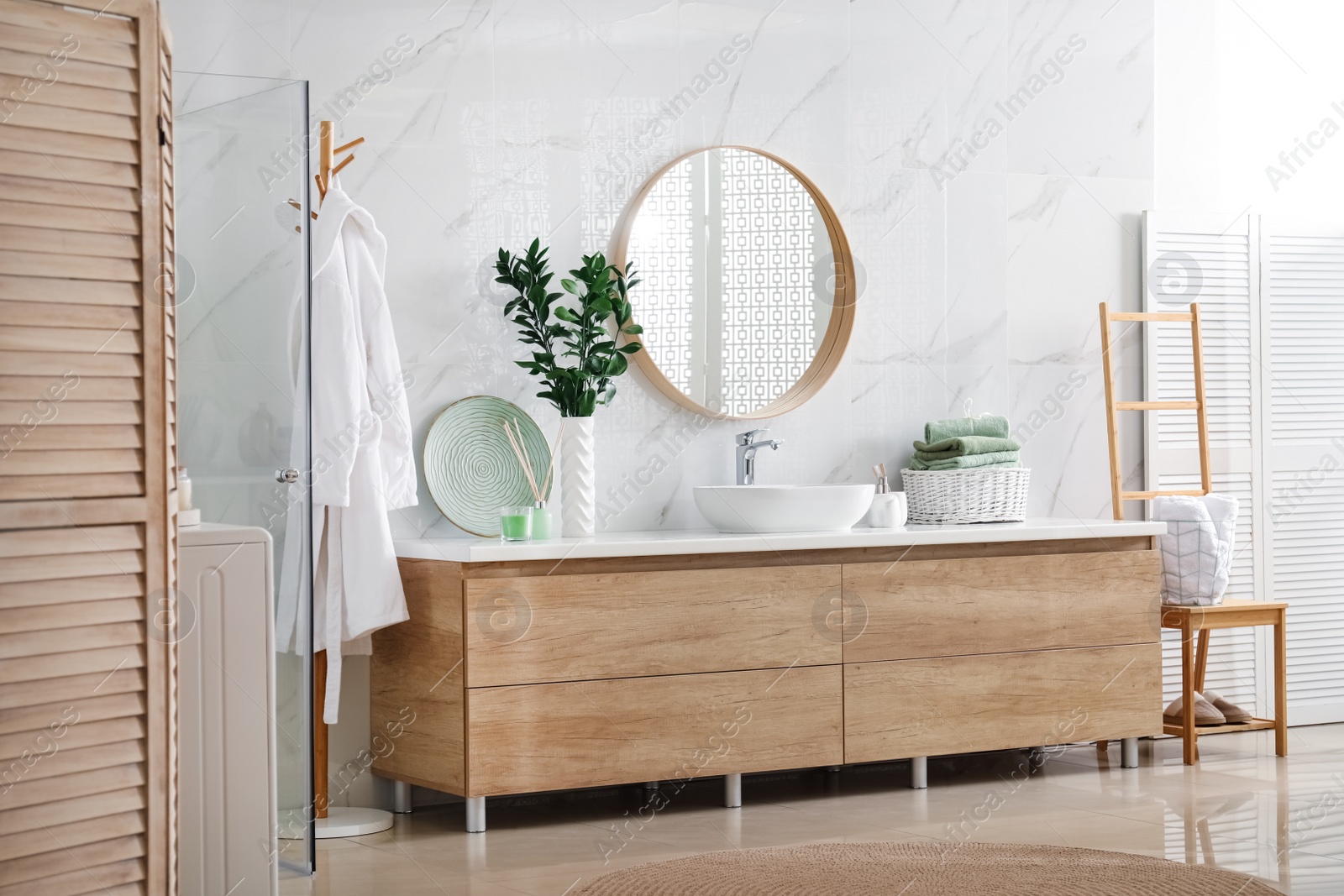 Photo of Modern bathroom interior with stylish mirror and vessel sink