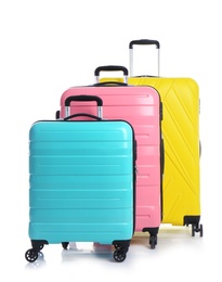 Photo of Modern suitcases for travelling on white background