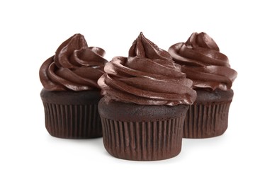 Delicious chocolate cupcakes with cream on white background