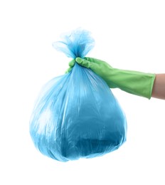 Photo of Woman holding plastic bag full of garbage on white background, closeup