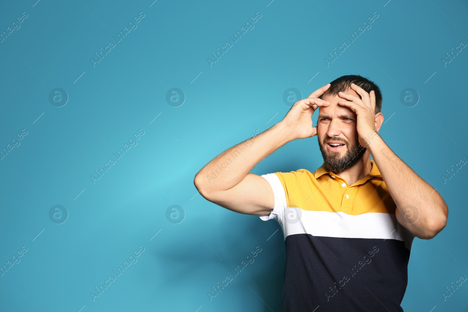 Photo of Portrait of man in casual clothes on color background