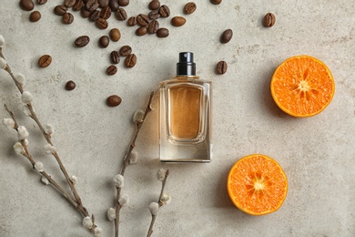 Photo of Beautiful composition with bottle of perfume on light background, flat lay