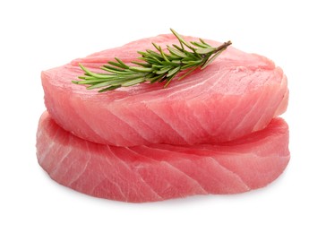 Photo of Raw tuna fillets with rosemary on white background