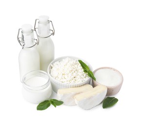 Photo of Different fresh dairy products and mint isolated on white