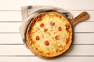 Photo of Delicious homemade cheese quiche on white wooden table, top view