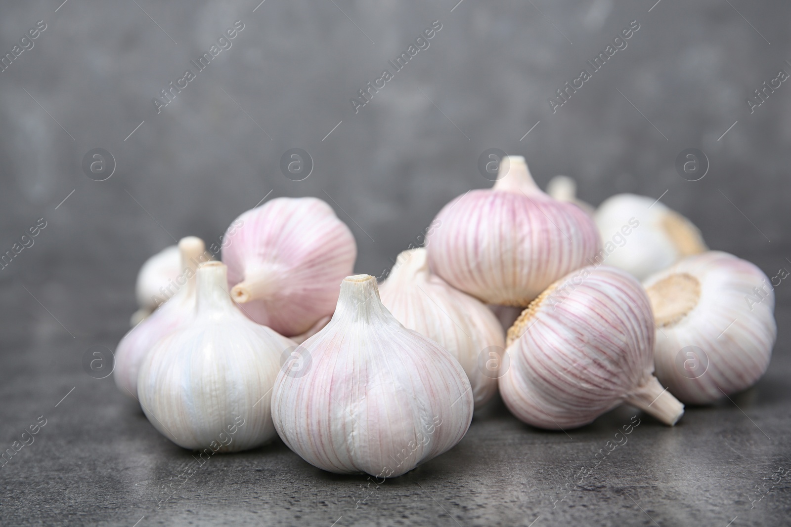 Photo of Ripe garlic bulbs on table. Organic product