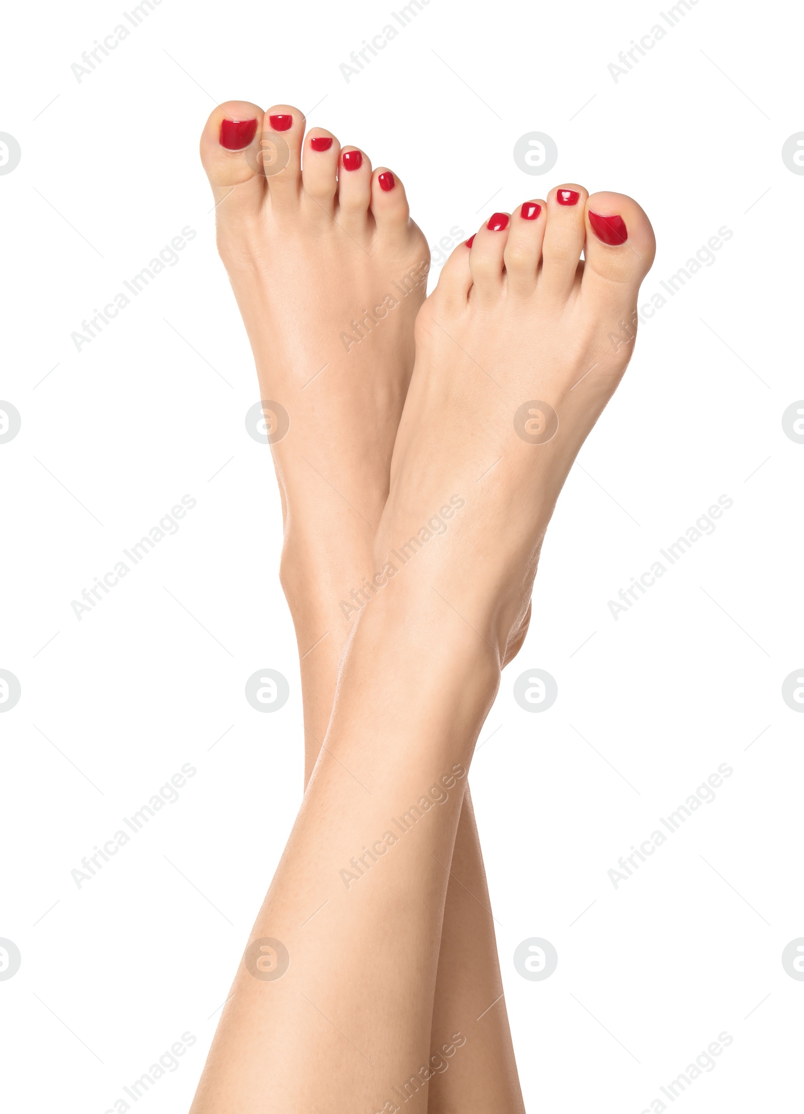 Photo of Woman with stylish red toenails after pedicure procedure isolated on white, closeup