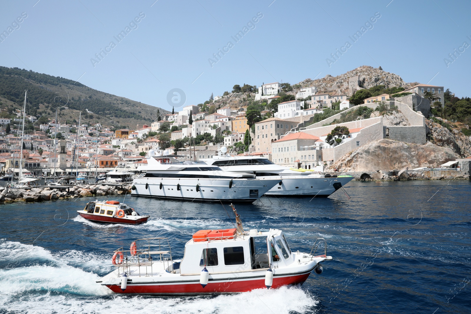 Photo of Beautiful view of sea with boats and coastal city