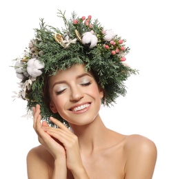 Photo of Happy young woman wearing wreath on white background