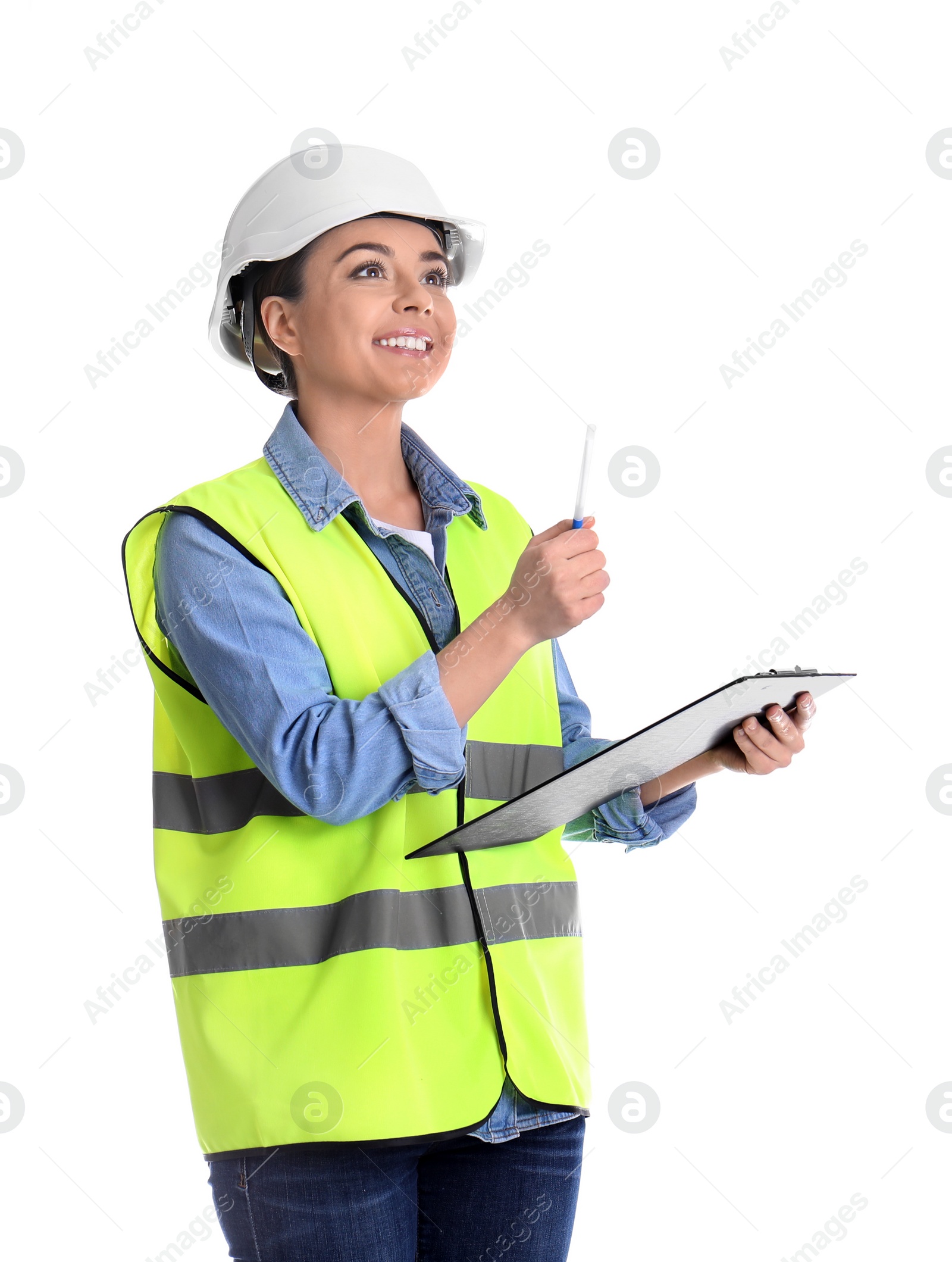 Photo of Female industrial engineer in uniform with clipboard on white background. Safety equipment