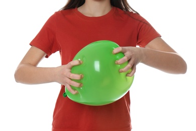 Woman squeezing green balloon on white background, closeup