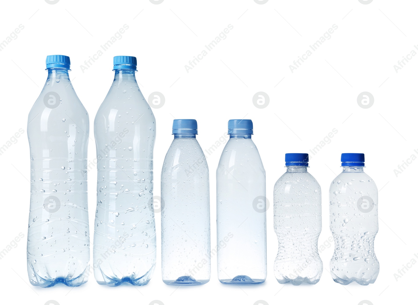 Photo of Empty plastic bottles on white background. Recycling problem